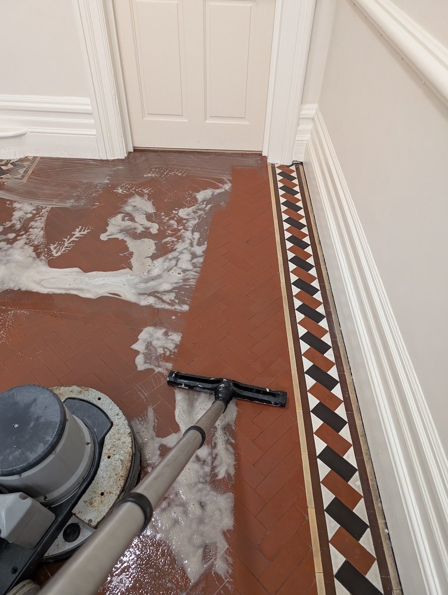 Deep cleaning of Victorian tiles in a hallway in Bristol